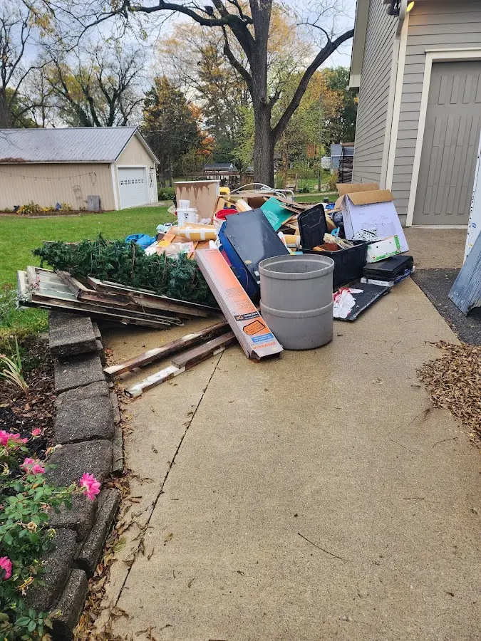 Dumpster being loaded with debris for Commercial Dumpster Rental in Hillsborough
